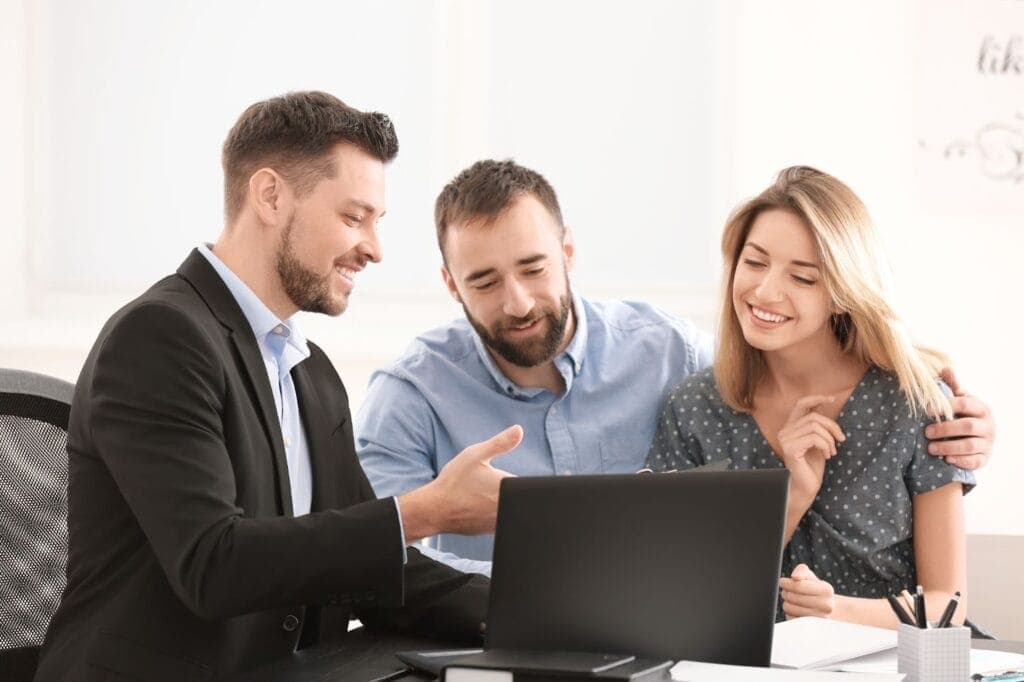 An accountant reviewing paperwork with clients