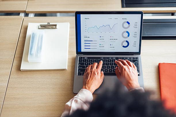 Financial reports open on a laptop